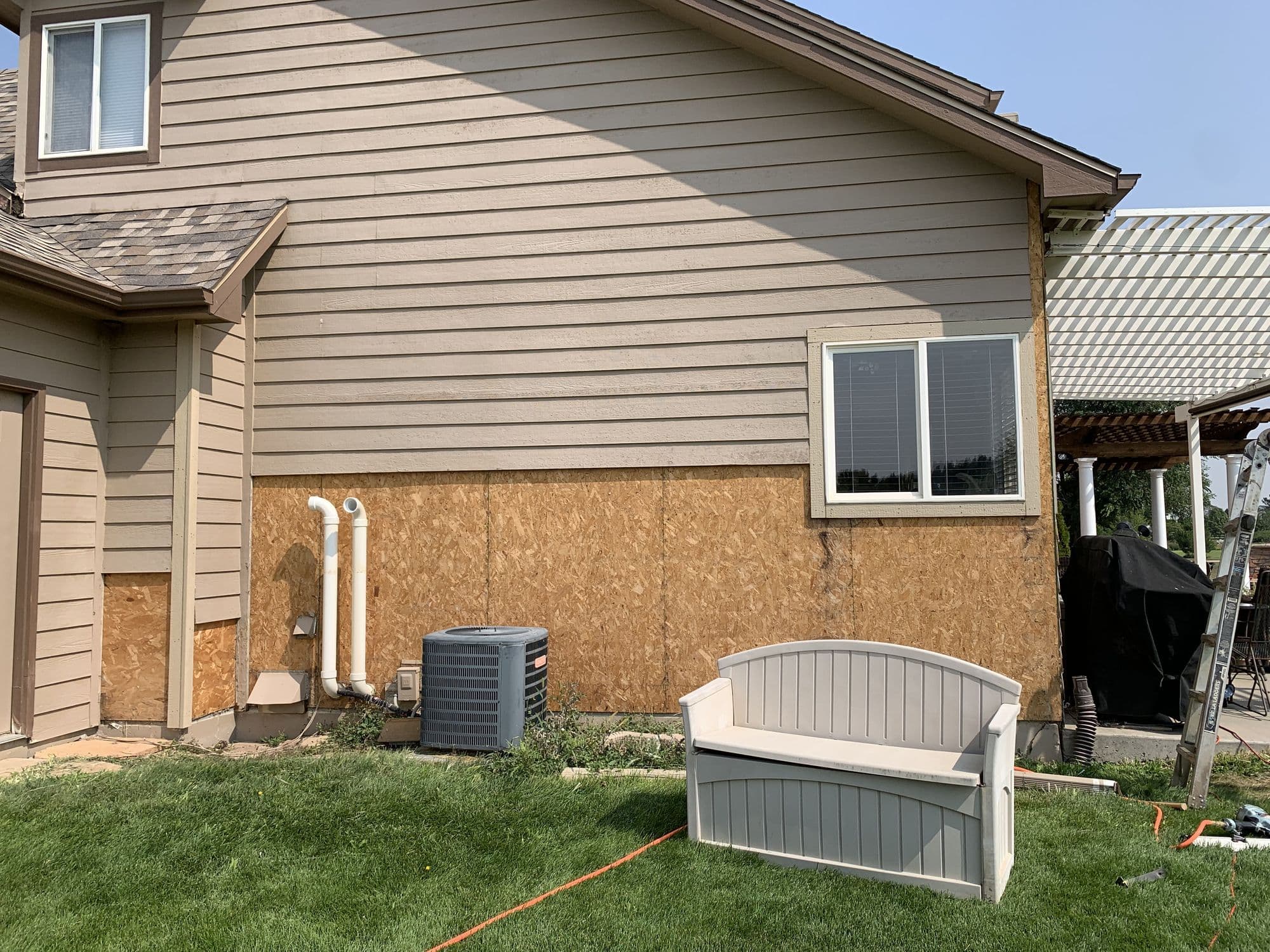 Siding repair in progress on a home in Windsor, Colorado