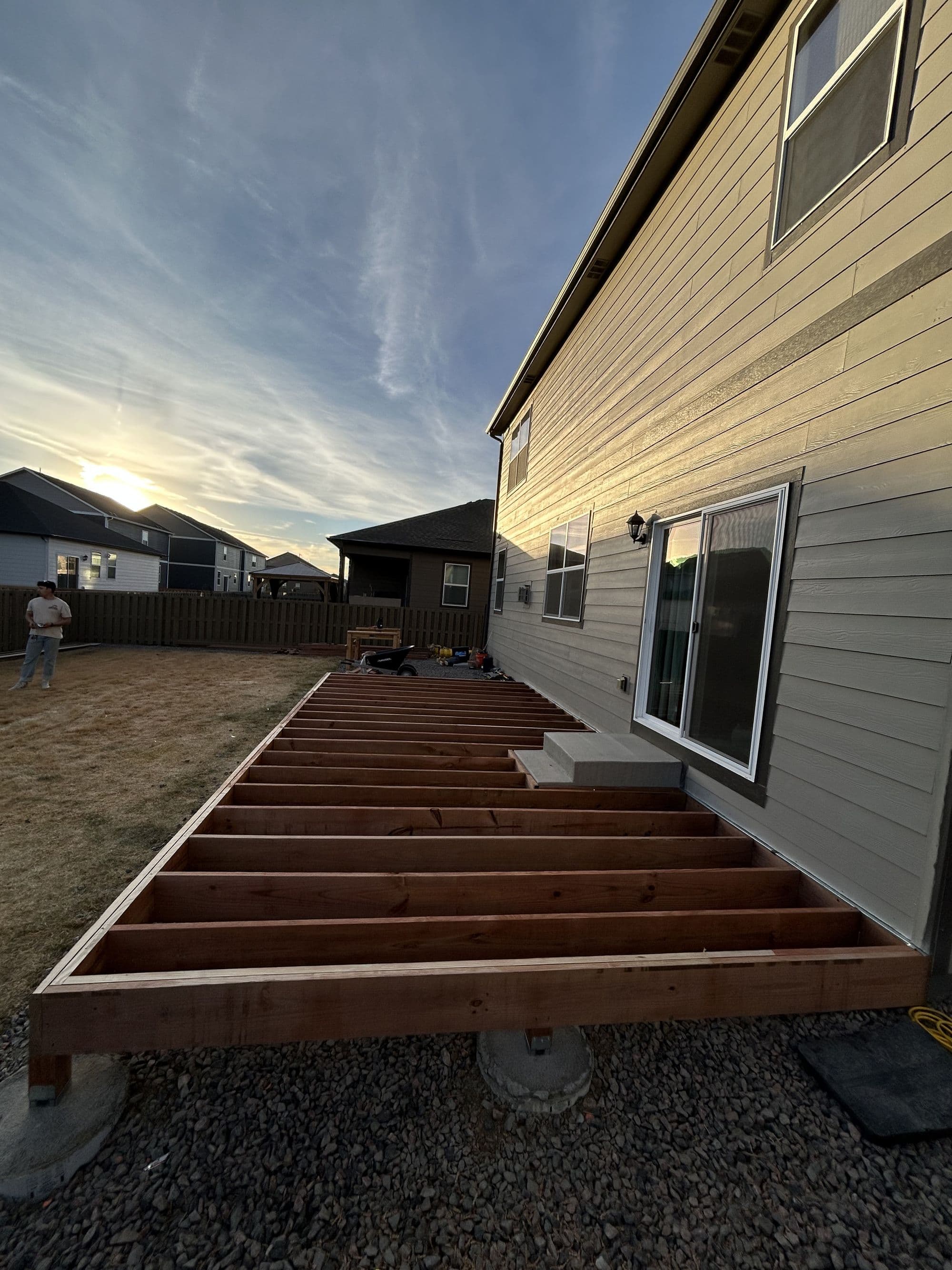 Finished multi-level deck with white and black railing, Johnstown, Colorado