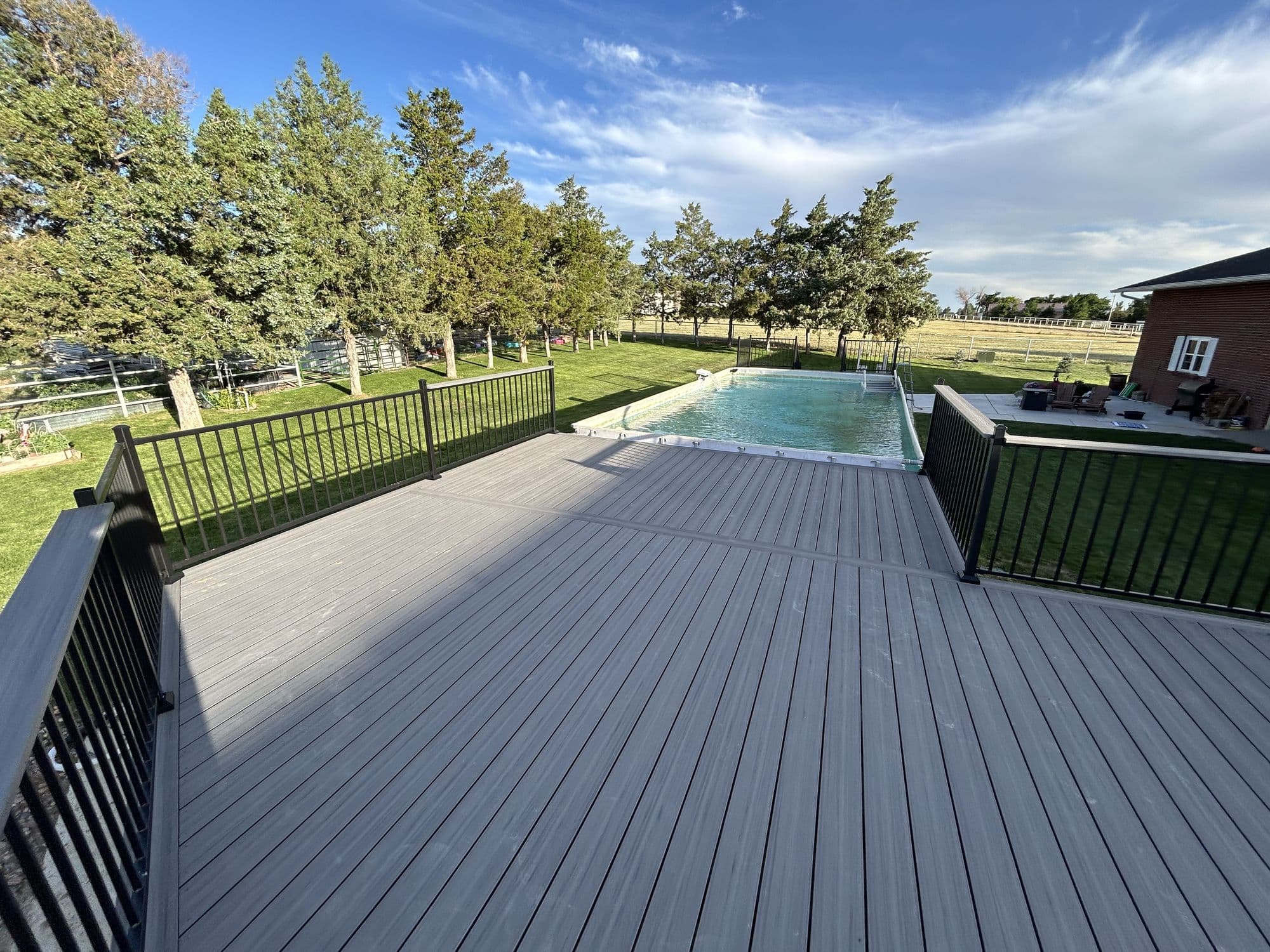 Finished pool deck with view of the pool
