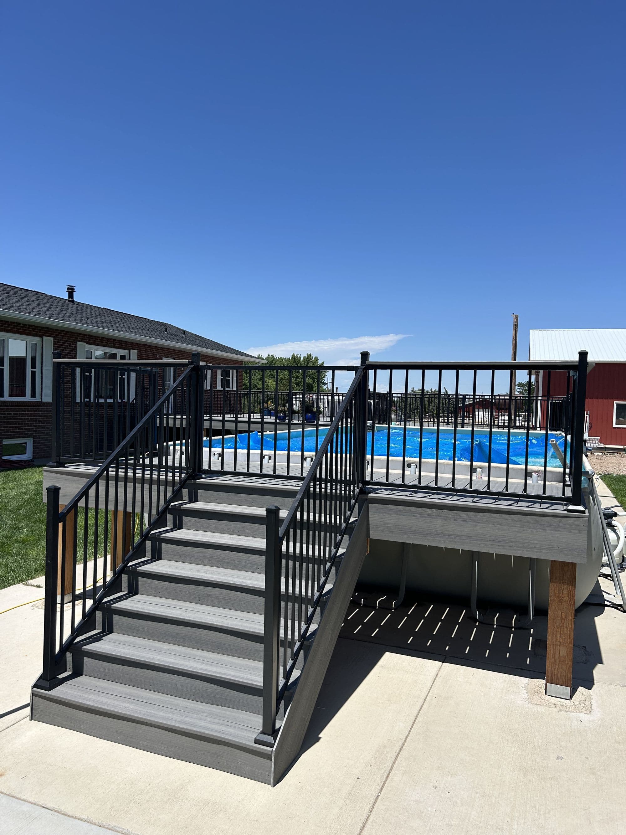 Finished pool deck staircase, wide hero view